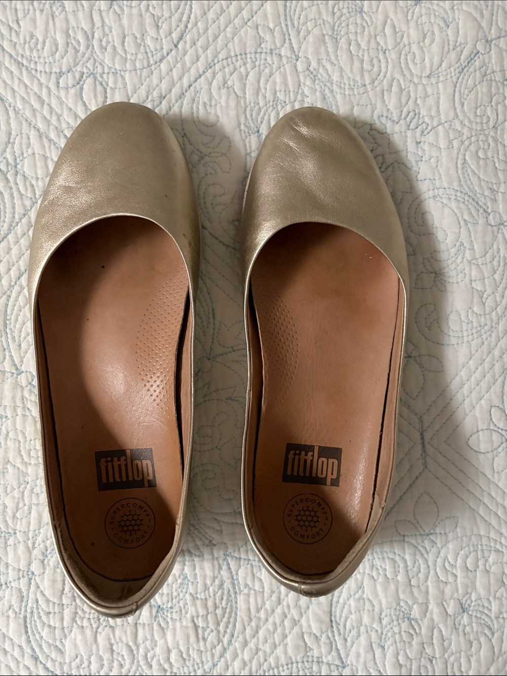 Fitflop Metallic Gold Leather Ballet Flats with a slight wedge.